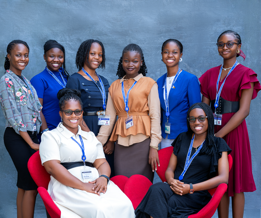A group of diverse women collaborating on a tech project